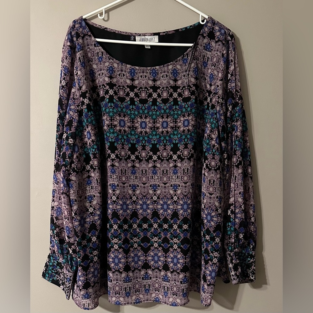 JENNIFER LOPEZ size 2X, geometric designed, long sleeved cold shoulder blouse.